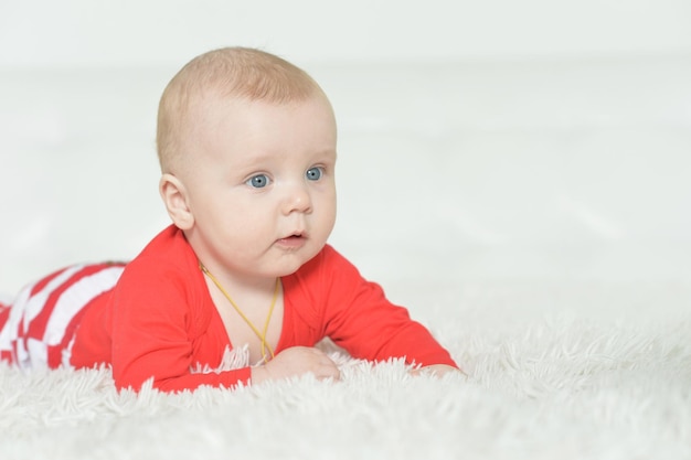 Adorable baby boy on background