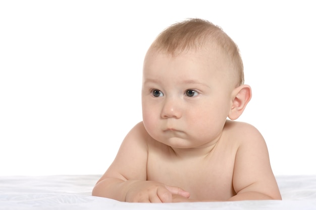 Adorable baby boy  on blanket on a white background