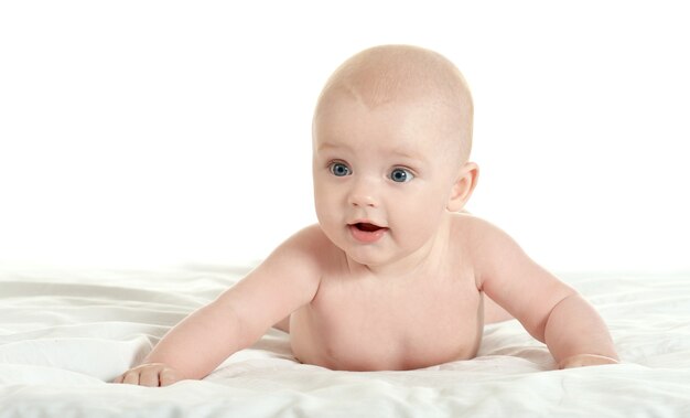 Adorable baby boy   on blanket on a white background