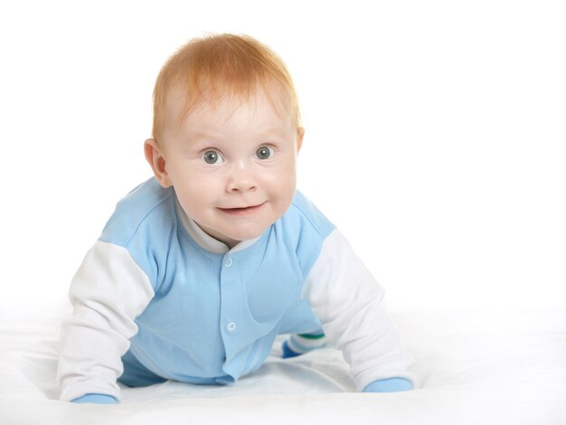 Adorable baby boy on blanket on a white background