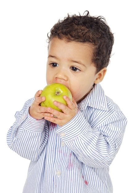 Photo adorable baby eating an apple a over white background