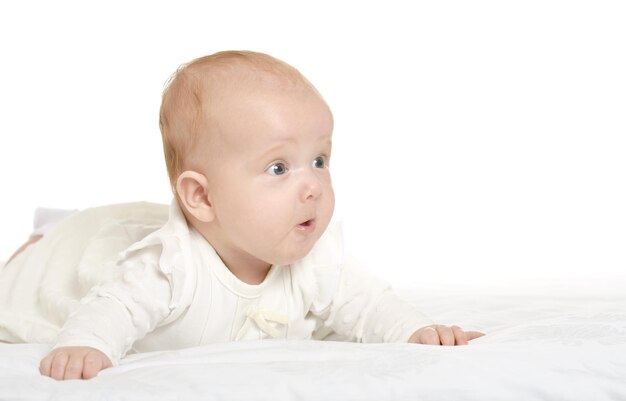 Adorable baby girl on blanket on a white background