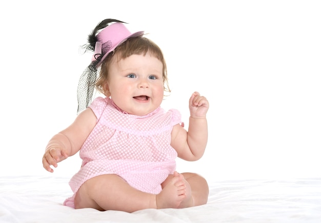 Photo adorable baby girl in pink clothes  on a white background