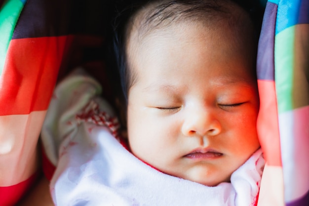 Adorable Baby girl sleep peacefully on car seat 