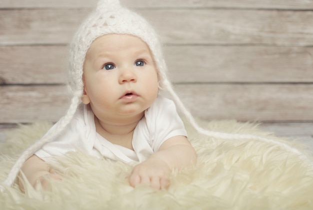 Adorable baby in white hat