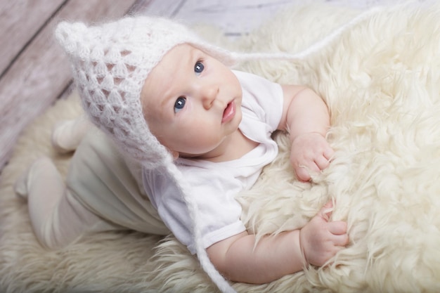 Adorable baby in white hat