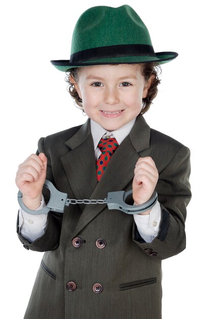 Adorable boy dressed gangster a over white background