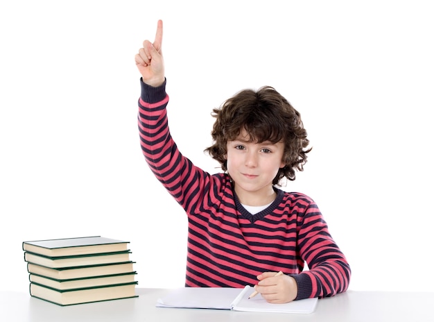 Adorable boy studying a over white background ask to speak isolated over white