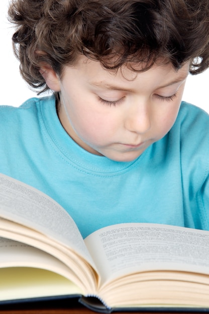 Adorable boy studying over white background