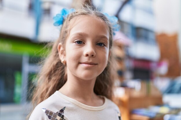 Adorable caucasian girl smiling confident standing at street