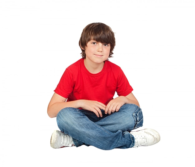 Adorable child sitting on the floor isolated on white background