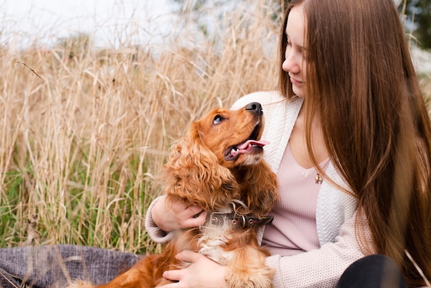 Adorable cocker spaniel with woman