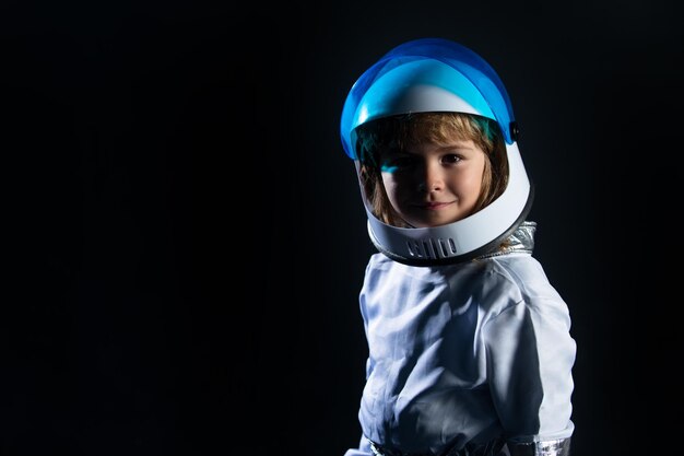 Adorable cute boy astronaut in outer space Child imagines himself to be an astronaut in an astronauts helmet Success creative and innovation technology concept