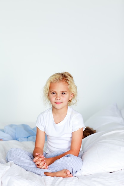 Adorable girl on a bed