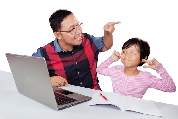 Adorable girl disturbed by his father scolding