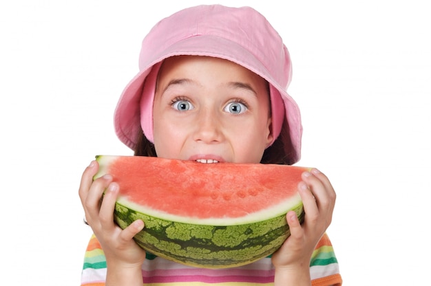 Adorable girl eating watermelon a over white background