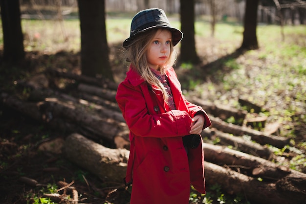 Adorable girl in raincoat