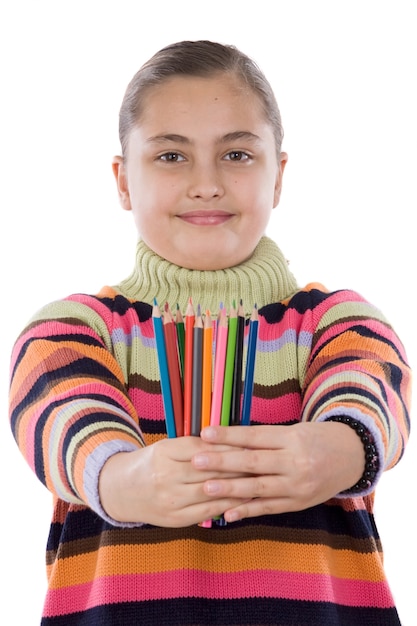 Adorable girl with many crayons of colors isolated over white