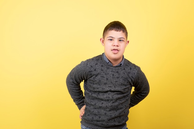 adorable kid in casual clothes standing and posing.