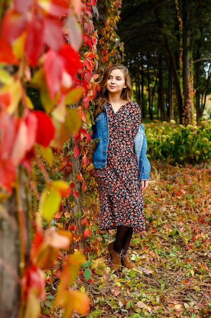 Adorable lady enjoying sunny autumn day