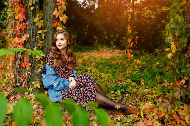 Adorable lady enjoying sunny autumn day