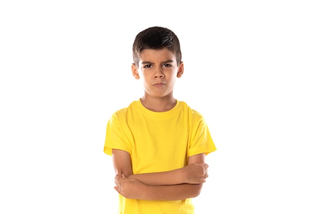 Adorable latin boy weraring a yellow t-shirt isolated on a white background