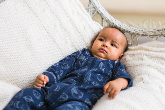 Adorable little african american baby boy looking. Black people.