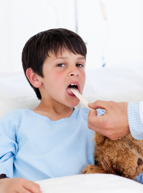 Adorable little boy attending medical exam