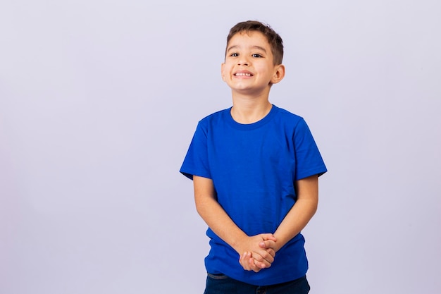 Adorable little Caucasian boy smiling looking at camera with free space for text