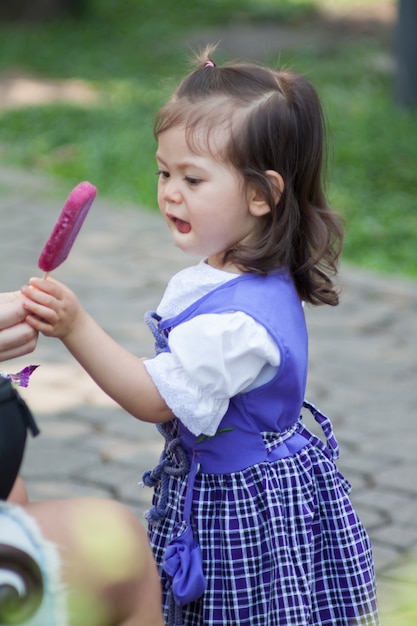 Adorable little cute girl with icecream