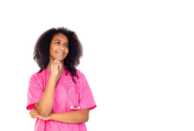 Adorable little doctor with pink uniform isolated  