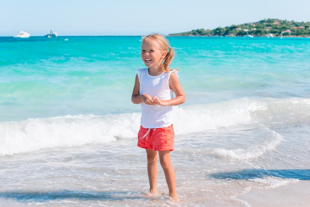 adorable little girl at beach on her summer vacation