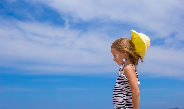 Adorable little girl have fun at tropical beach