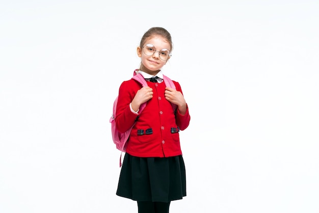 Adorable little girl in red school jacket black dress rounded