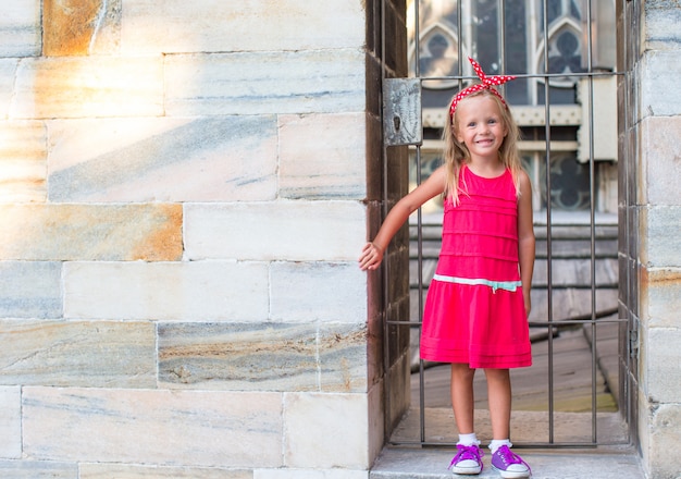 Adorable little girl on the rooftop of Duomo, Milan, Italy