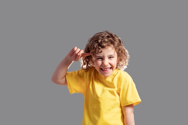 Adorable little girl with blond curly hair during fools day