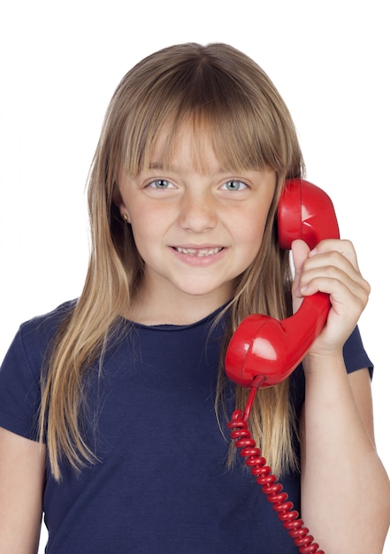 Adorable little girl with a dark blue t-shirt and a phone