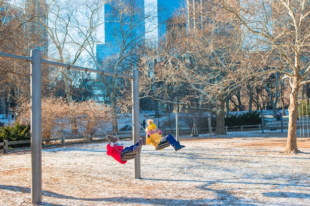 Adorable little girls having fun in Central Park at New York City