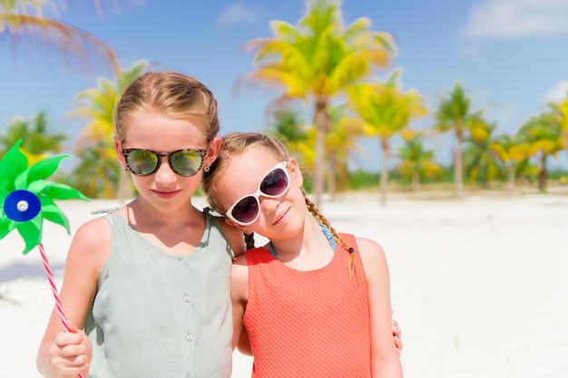 Adorable little girls during summer tropical vacation