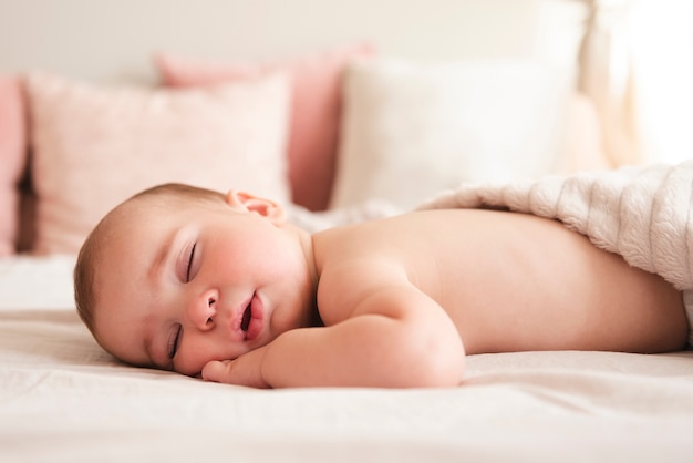 Adorable newborn baby sleeping close up