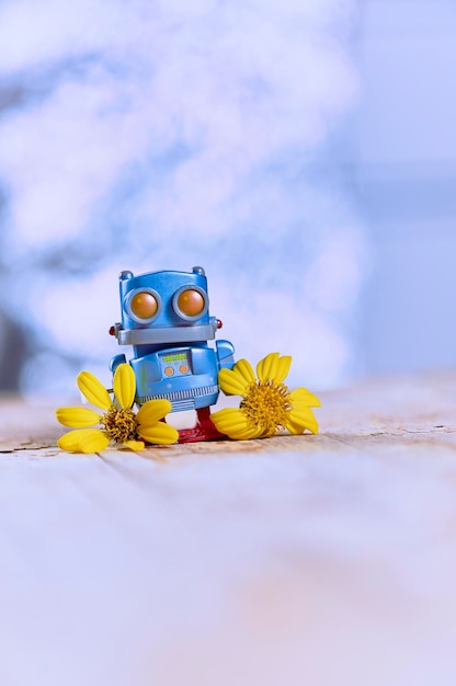 Adorable robot waiting for his beloved with a bouquet of flowers concept for valentine's day on diffused background