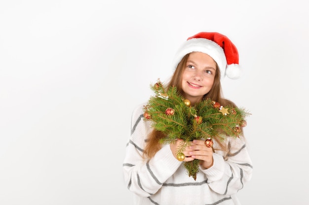 Adorable smiling girl with Santa red hat 