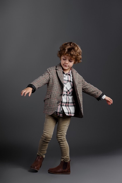 Adorable stylish little boy with a jacket