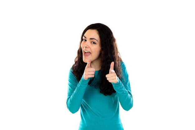 Adorable teenage girl with blue sweater isolated on a white wall