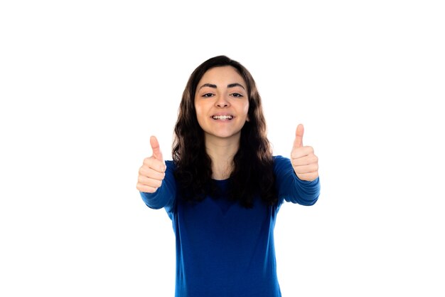 Adorable teenage girl with blue sweater isolated on a white wall