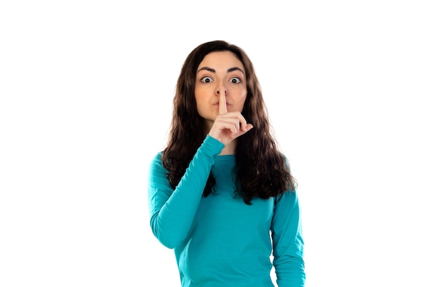 Photo adorable teenage girl with blue sweater isolated on a white wall