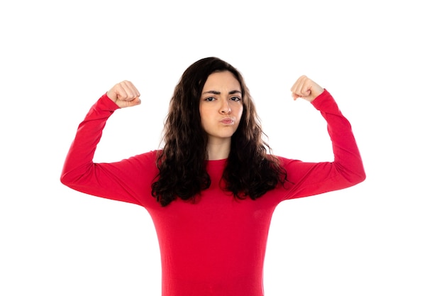 Adorable teenage girl with red sweater isolated on a white wall