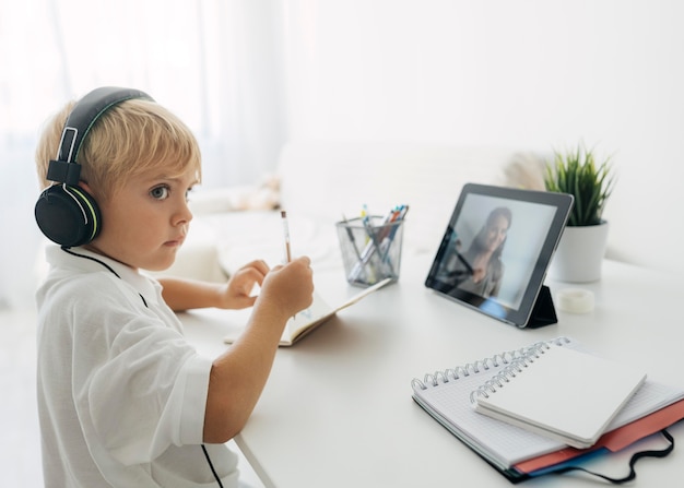 adorable young boy home schooling