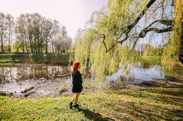 Adorable young girl having fun in a spring park