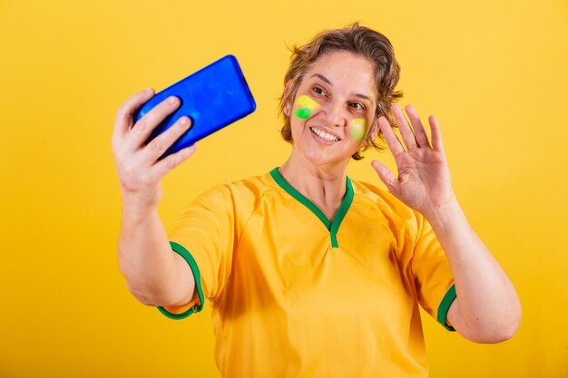 Adult adult woman brazil soccer fan smartphone video call
